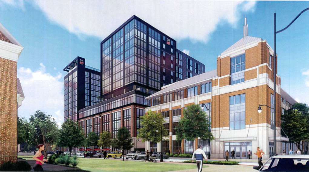 Image: Conceptual rendering of two portions of one building. On the right, a brick building with a pointed top. On the left, a black building with many windows. There's a blue sky with clouds in the background. Photo from City of Champaign's council report.