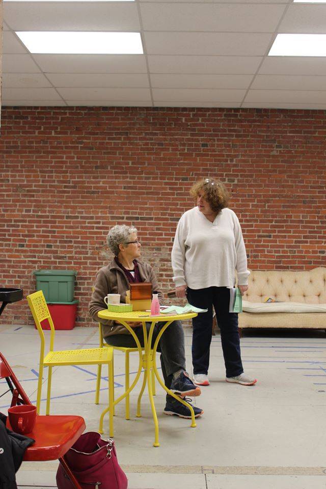  Image: Photo of two women, actors rehearsing Steel Magnolias at the Parkland College Second Stage, with one seated and one standing behind her. Photo from CUTC Facebook page