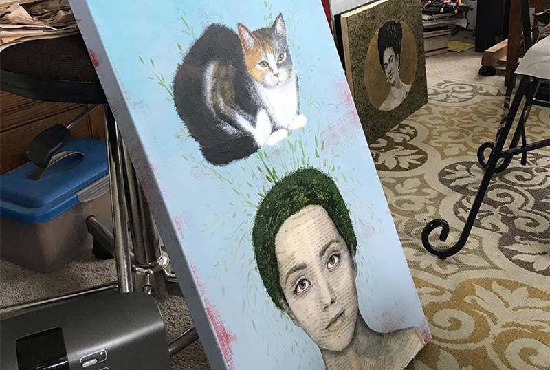 Image: Photo of painting of woman and cat in process in artist's studio. Photo from Instagram.
