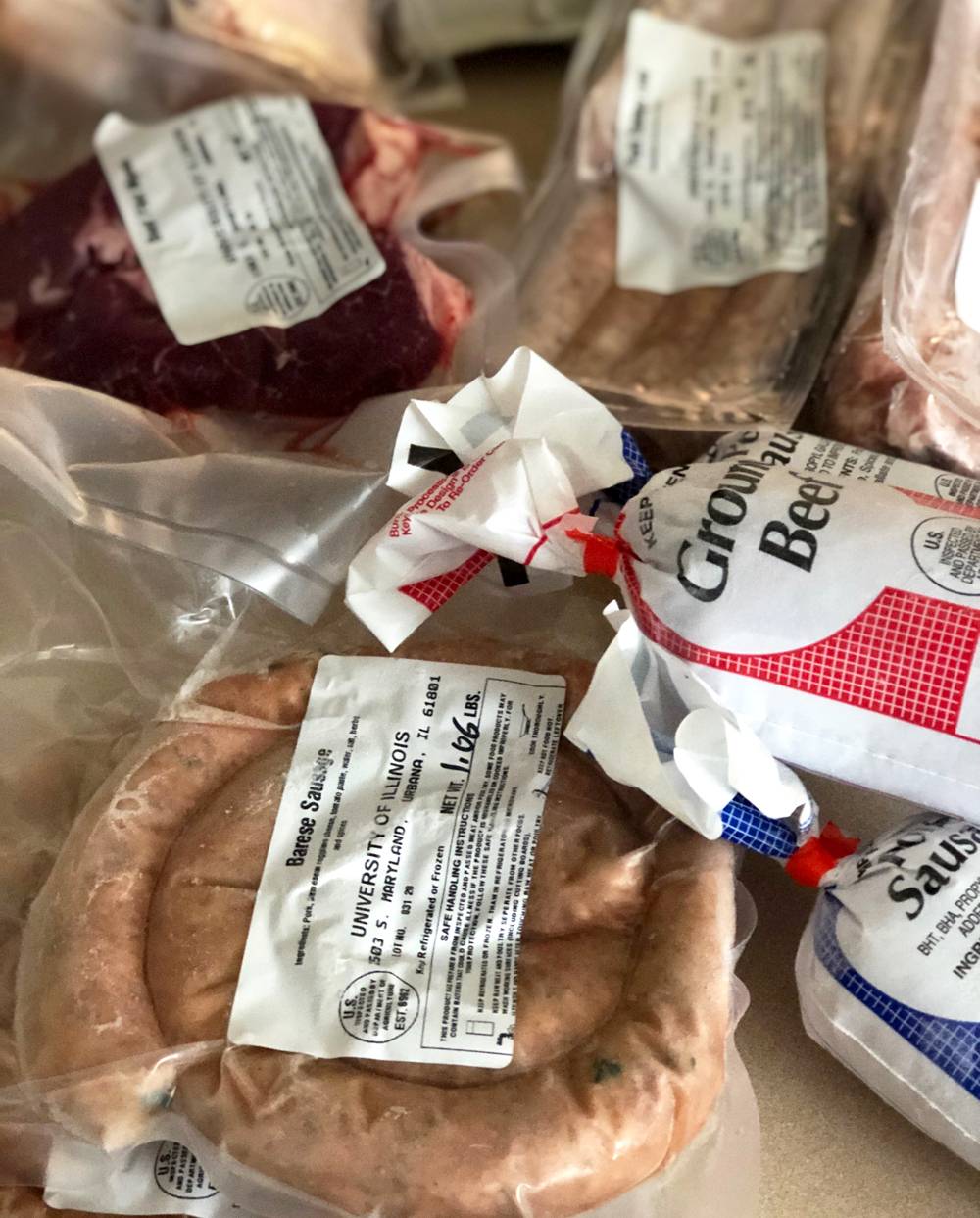 Various vacuum-sealed meats on a countertop. Photo by Jessica Hammie. 