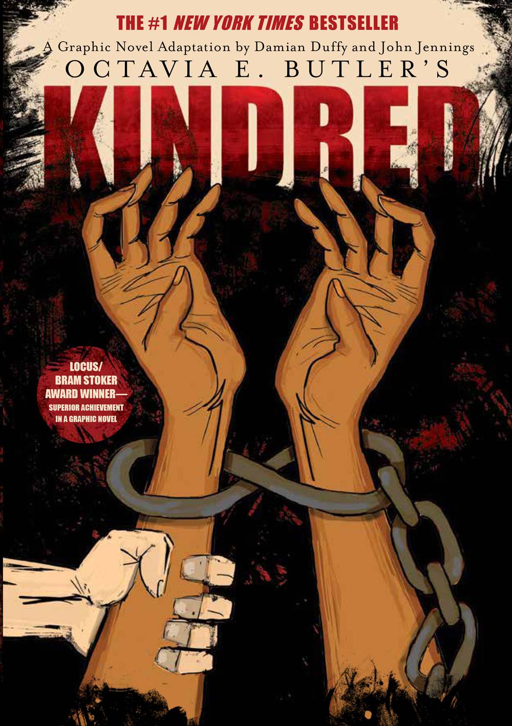 The cover of Kindred: A Graphic Novel Adaptation features two brown arms reaching upward, with chains around the wrists. A white hand grabs the left arm. Artwork by John Jennings. Image courtesy of Damian Duffy.