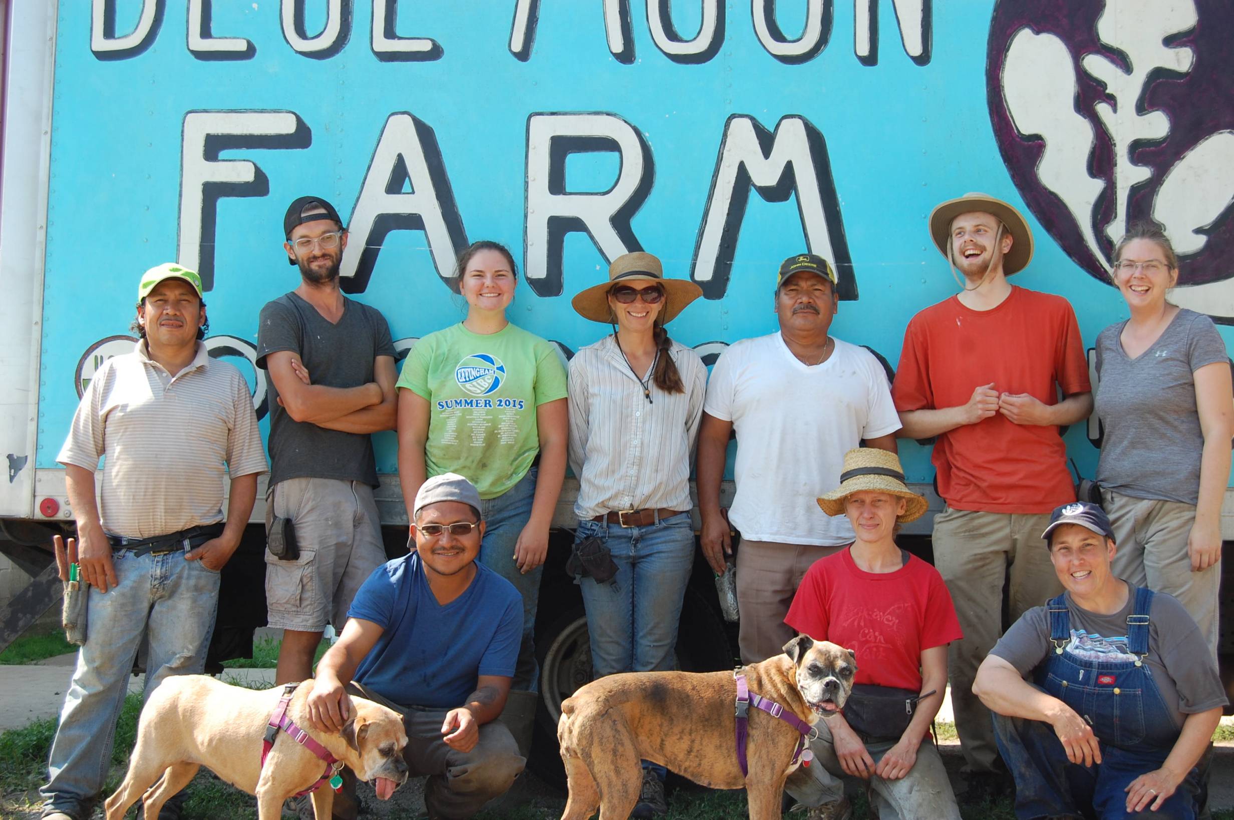 The Blue Moon Farm staff smiles in front of their beautifully painted farm truck. Photo by Blue Moon Farm.