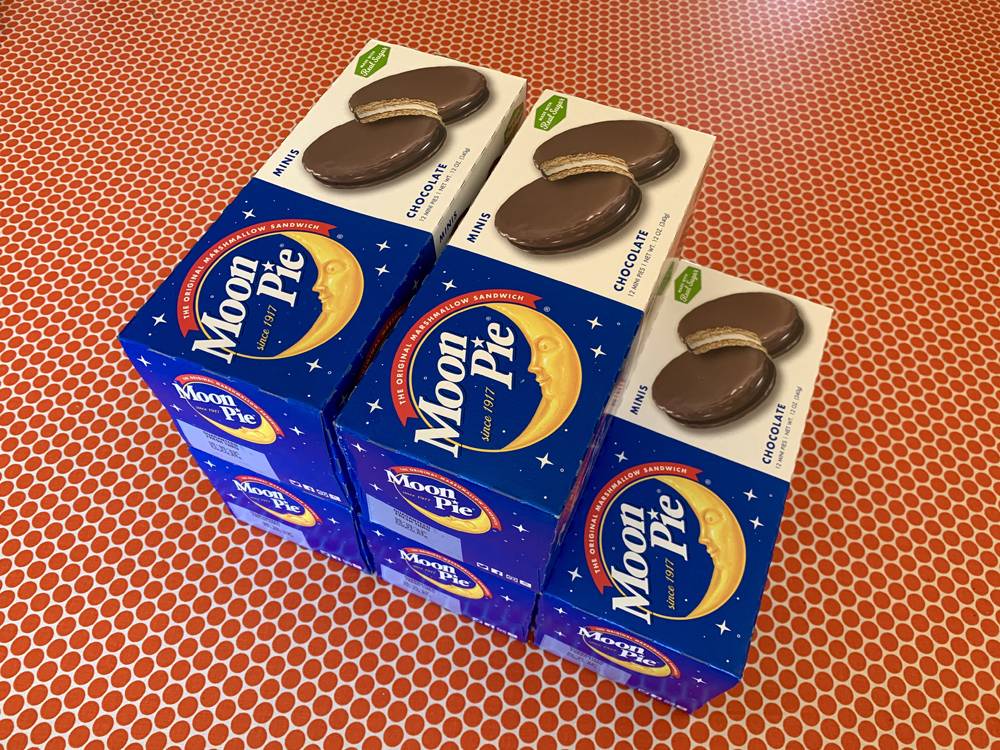 Five boxes of Moon Pies are stacked on a table with an orange polka dot covering. Photo by Kevin Hamilton. 