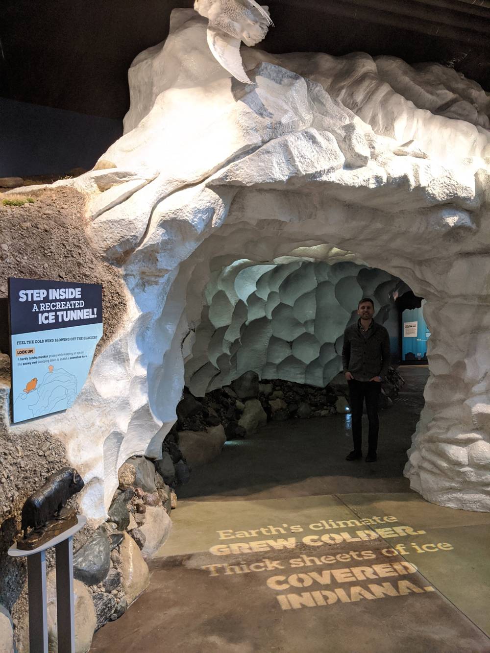 Jonathan Hafer is standing in a museum exhibit of an ice tunnel. There is a large, built tunnel made to resemble ice at the Indiana State Museum in Indianapolis. Photo courtesy of Jonathan Hafer. 