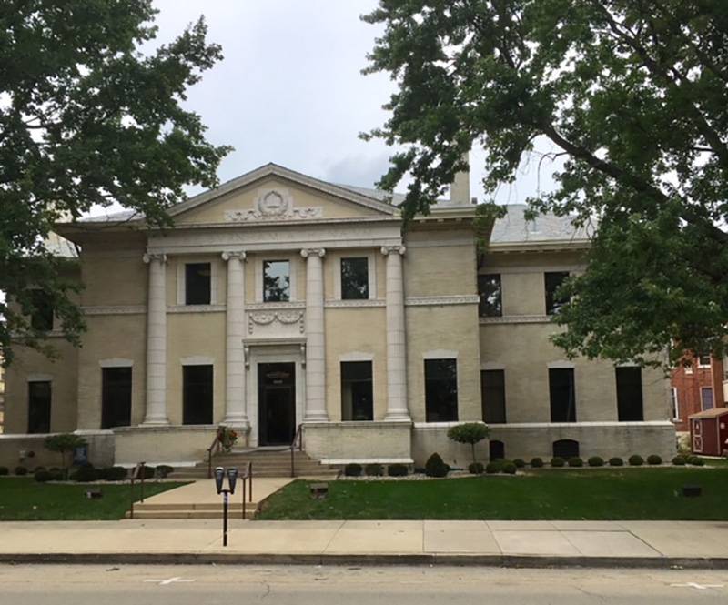 Burnham Athenaeum (Meyer Capel Law Offices), looking north from West Side Park.  Neo-Classical design, columned faÃ§ade with upper gable, white brick, carved stonework. Photo by Rick D. Williams.