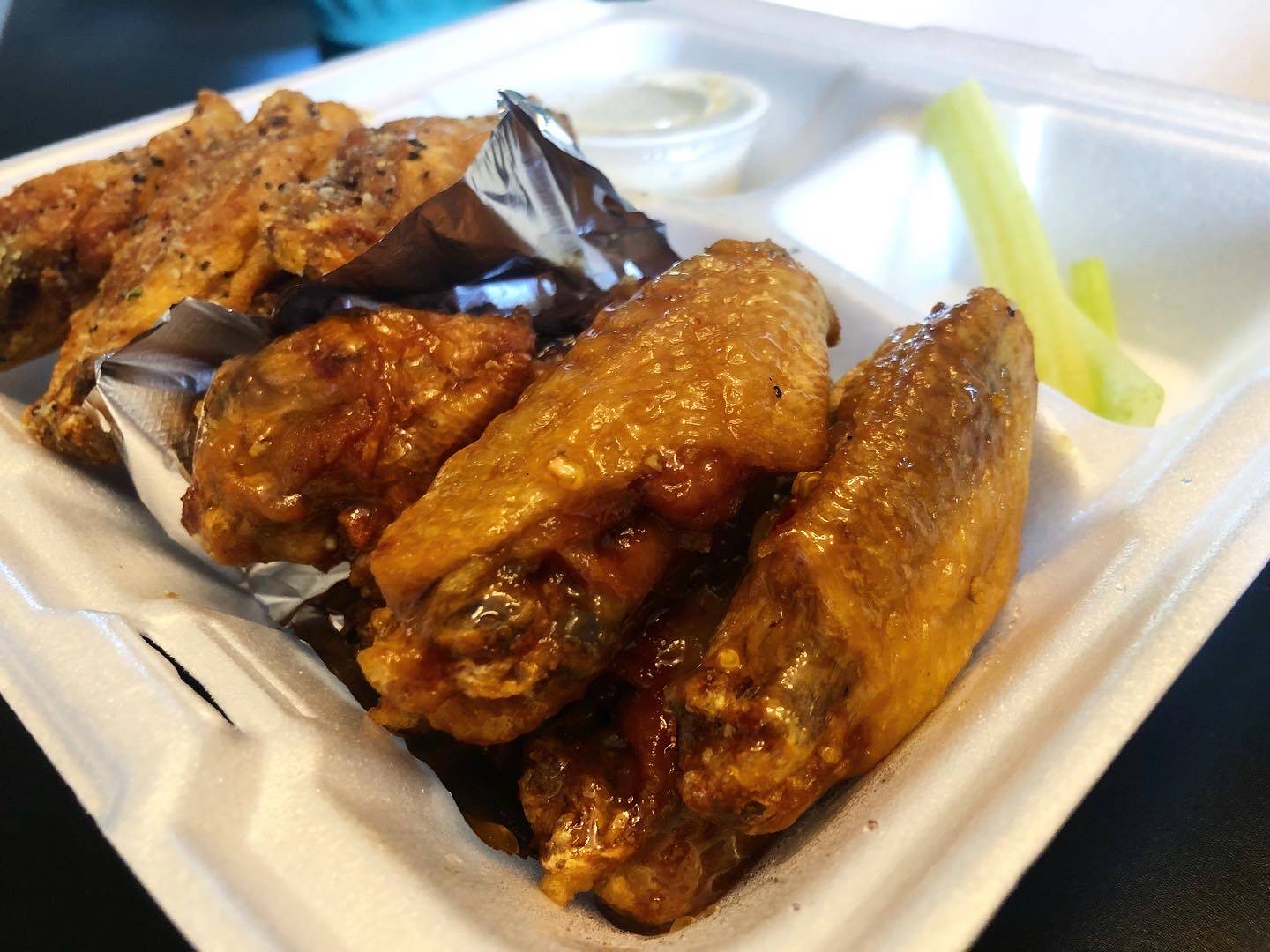 A close up of the five wings with rum sauce. Photo by Alyssa Buckley.