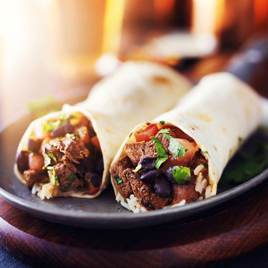 Burrito De Asada: Two burritos de asada filled with rice, black beans, and salsa. Photo from Taco Motorizado's Facebook page.
