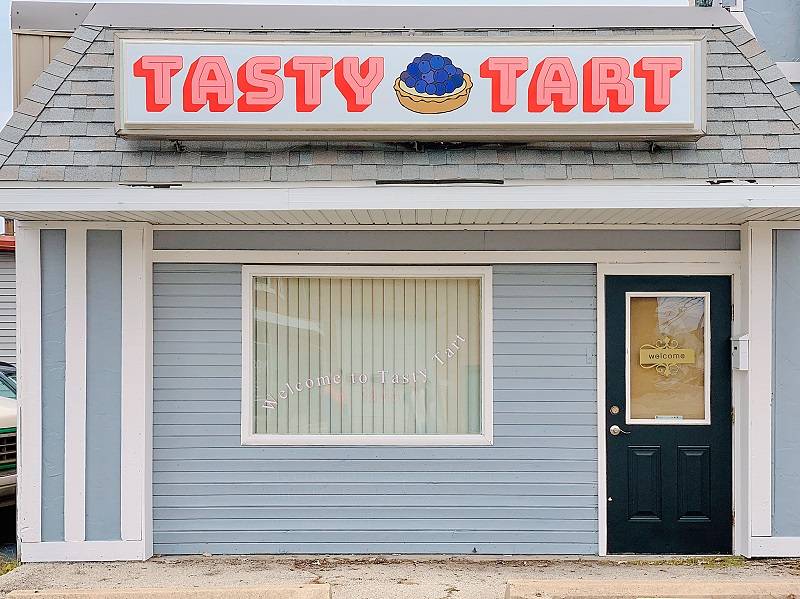 Tasty Tart storefront with the blinds closed and a welcome sign on the door. Photo by Tasty Tart.