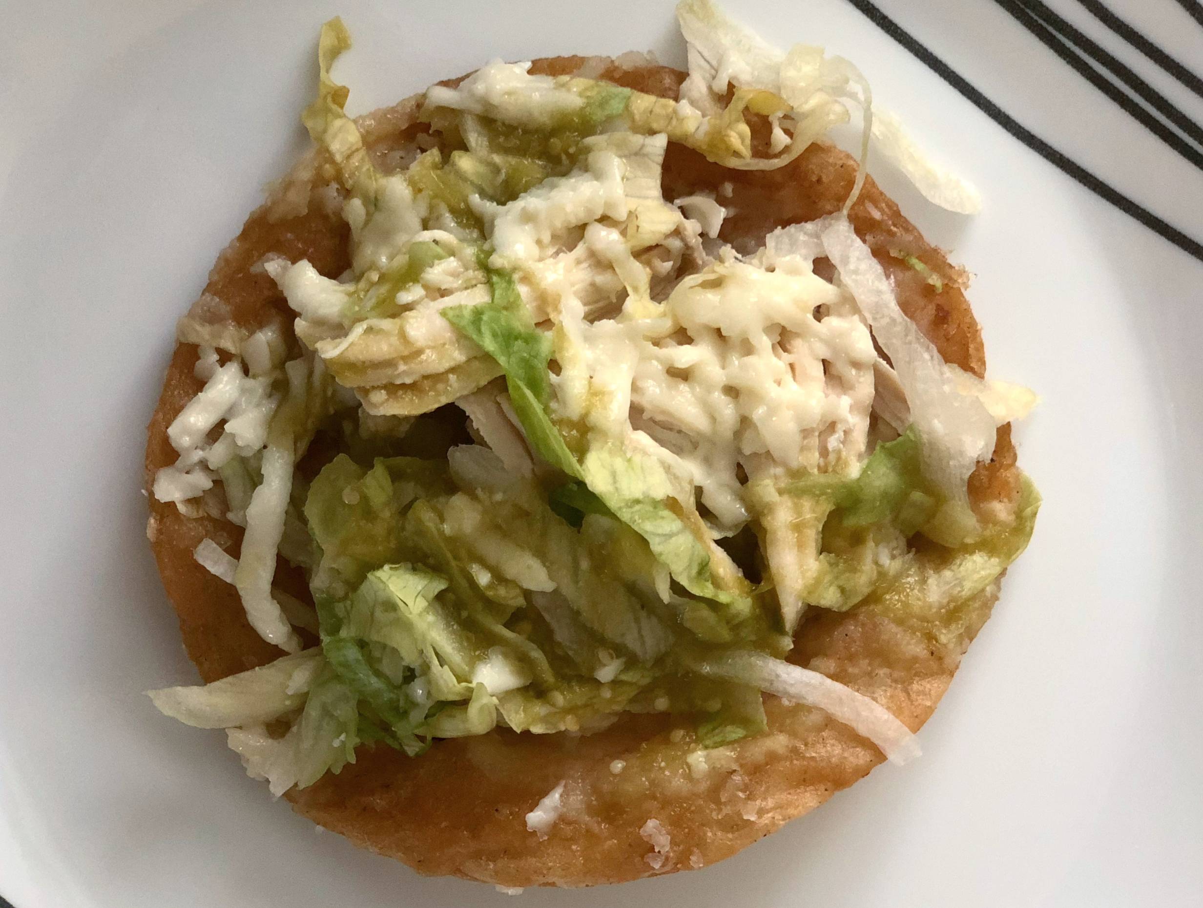 A single chalupa on a white plate. Photo by Alyssa Buckley.