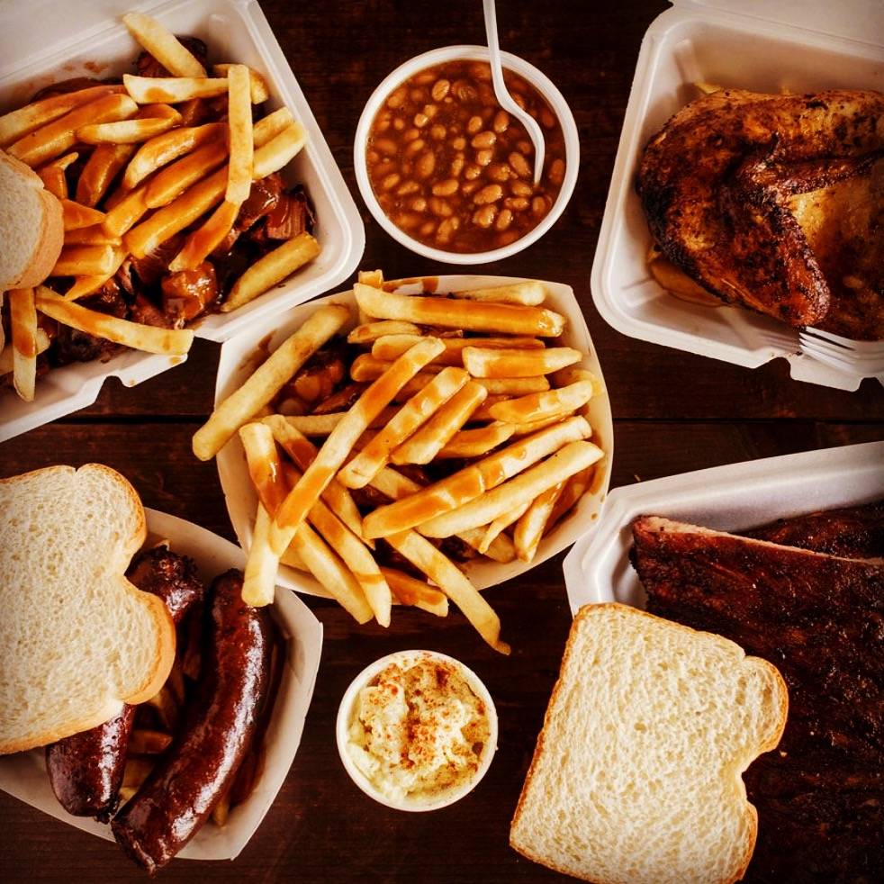 A lot of delicious barbecue options with fries in the center. Photo from Wood N' Hog Facebook page.