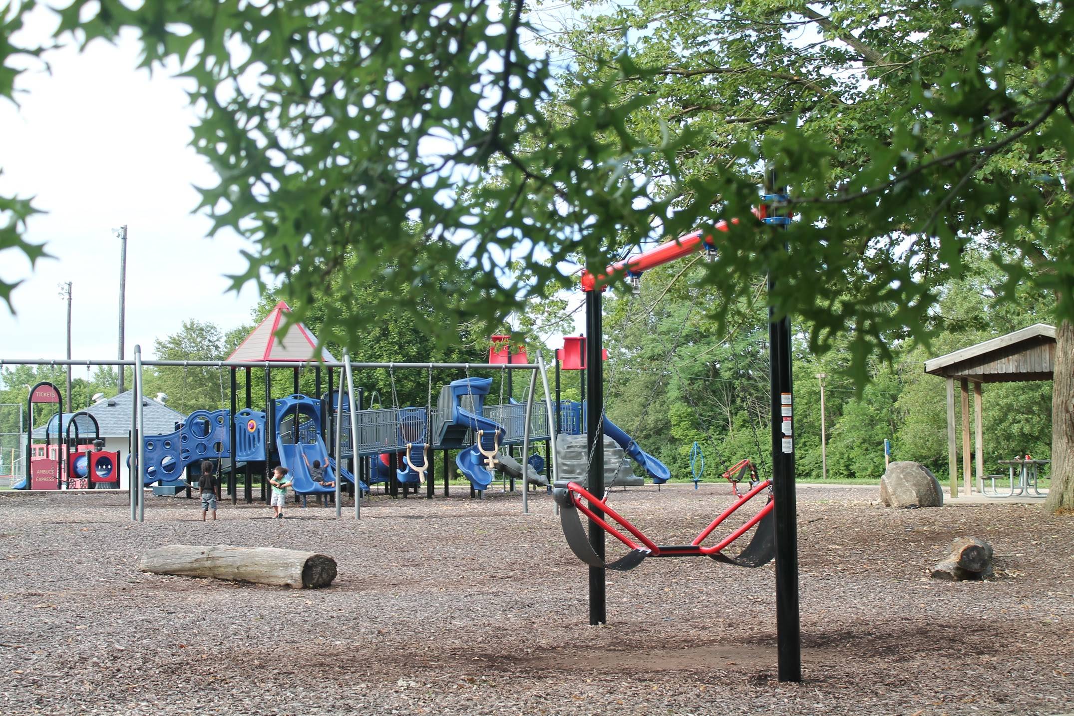 An accessible playground at Ambucs Park, featuring colorful equipment for kids. Photo by Maddie Rice.
