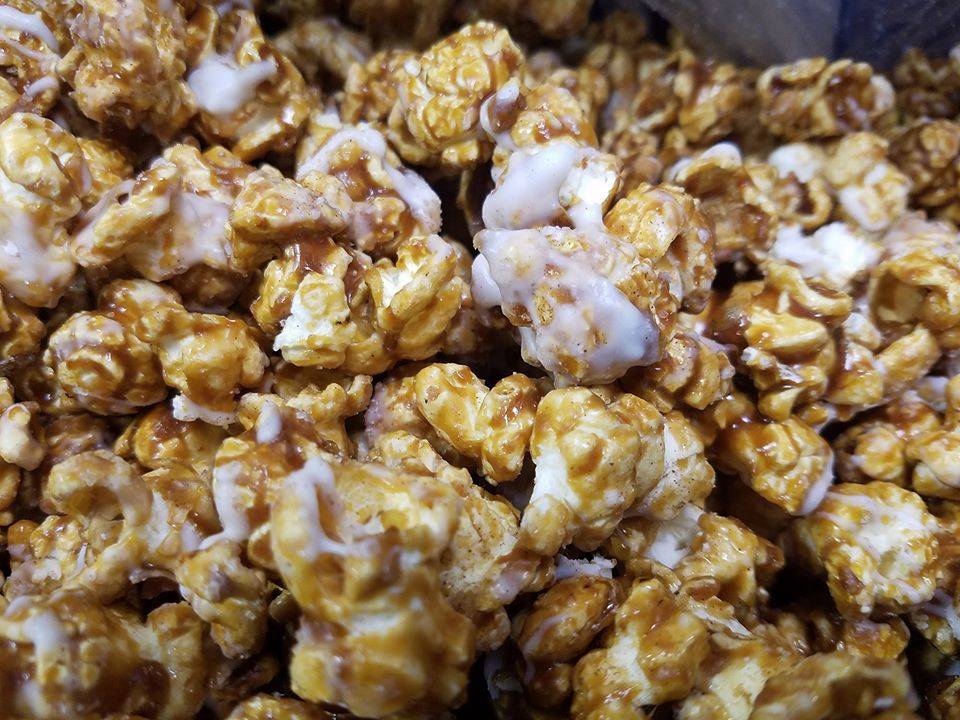 A close up shot of caramel popcorn drizzled with white icing. Photo from CBPB Facebook page. 