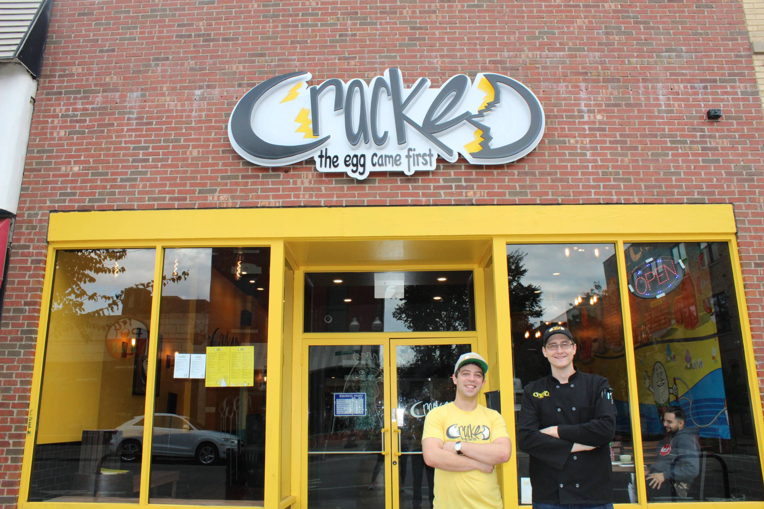 The owners, Daniel Krause and Elliott West, pose in front of Cracked's Green Street location. Photo provided by Cracked.
