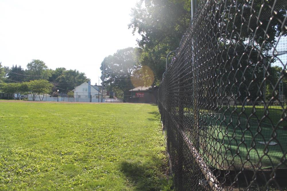 A picture of a baseball diamond taken from deep left field