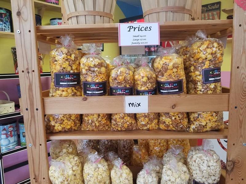 Variety of popcorn shown on display, specifically caramel and cheese mixes. Photo by CBPB.