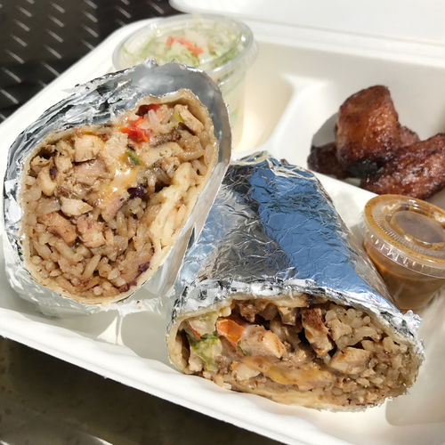 Jerk chicken burrito meal- made with rice &#039;n peas, jerk chicken, cheese, lettuce, sour cream &amp; pico de gallo rolled in a large flour tortilla. Photo from Caribbean Grill's website.