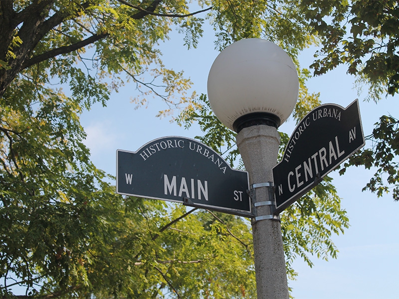 A picture of two street signs that state Main and Central 
