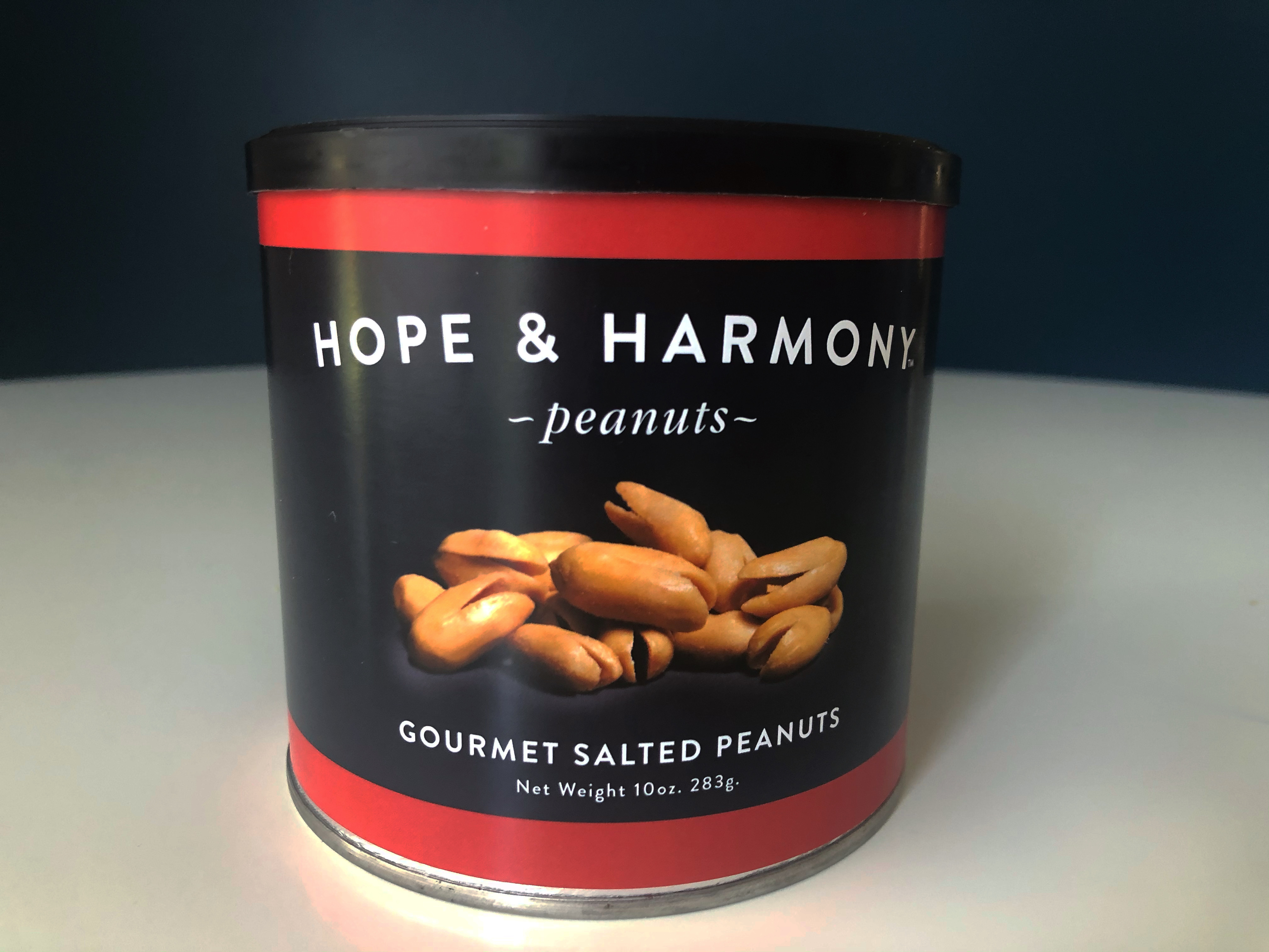 A can of Hope & Harvest gourmet peanuts sits on a white table. Photo by Alyssa Buckley.