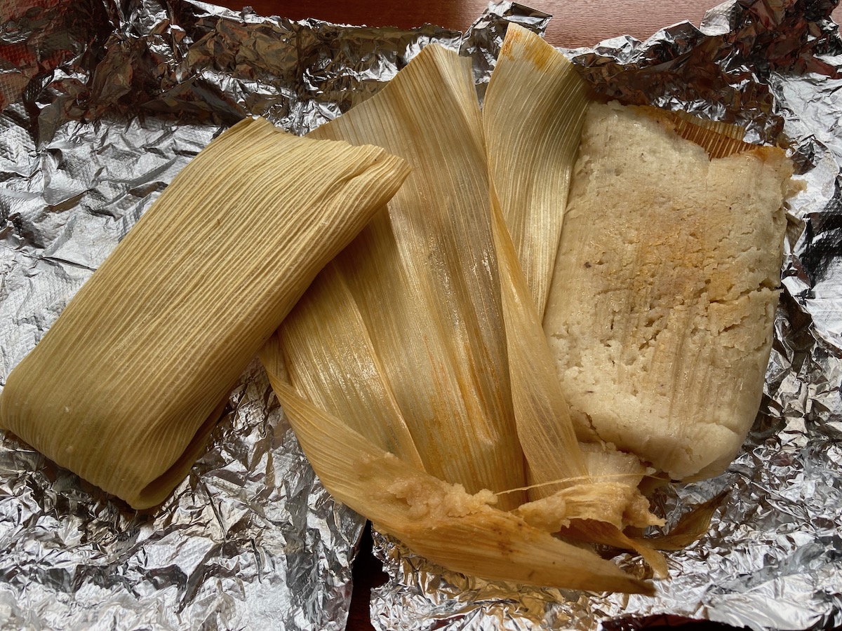 Tamales from Rick's Bakery lay on tin foil. Photo by Anthony Erlinger.