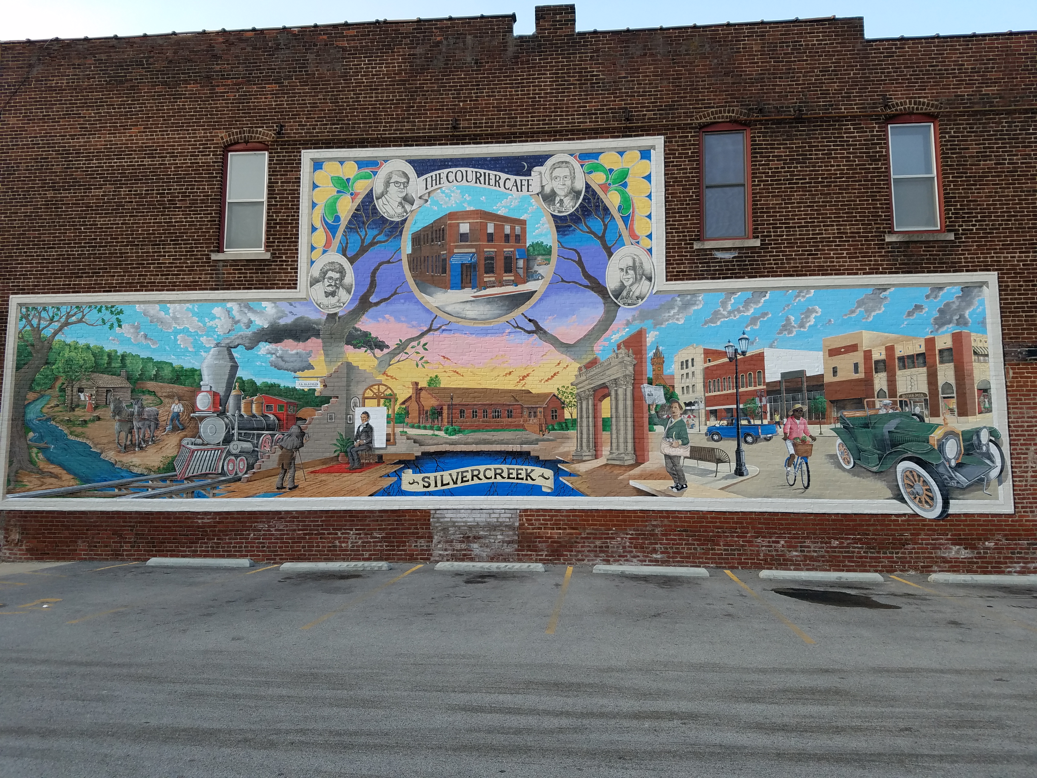 On another side of the exterior of the building, an intricate and large mural covers the entire brick side. It consists of various vibrant colors depicting the origin of the Courier Cafe and its sister restaurant, Silver Creek. The painting is full of old trains, cars, and the four men who started the Courier newspaper originally. Photo by Allen Strong.