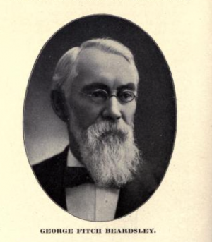 A portrait of George F. Beardsley wearing a lond grey beard