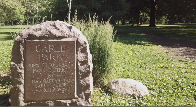 a rock with a plaque declaring the space to be Carle Park 