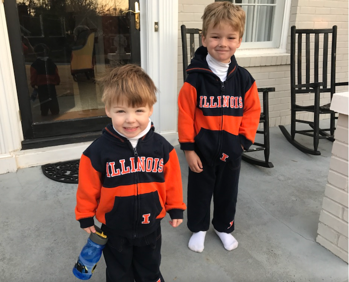 two young boys smiling wearing Illinois outfits 