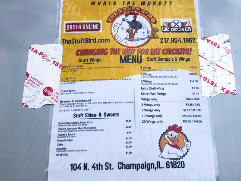 A laminated poster of The Stuft Bird's menu is duct taped to the silver food truck. Photo by Alyssa Buckley.