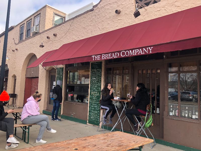 The Bread Company's front patio, featuring a red awning. Photo by Alyssa Buckley.
