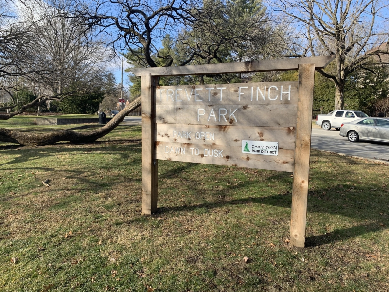 a wooden sign that states Trevett Finch Park 