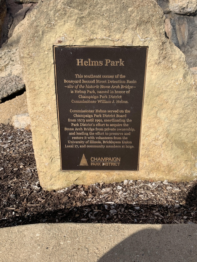 Helms Park sign embedded into a limestone rock 