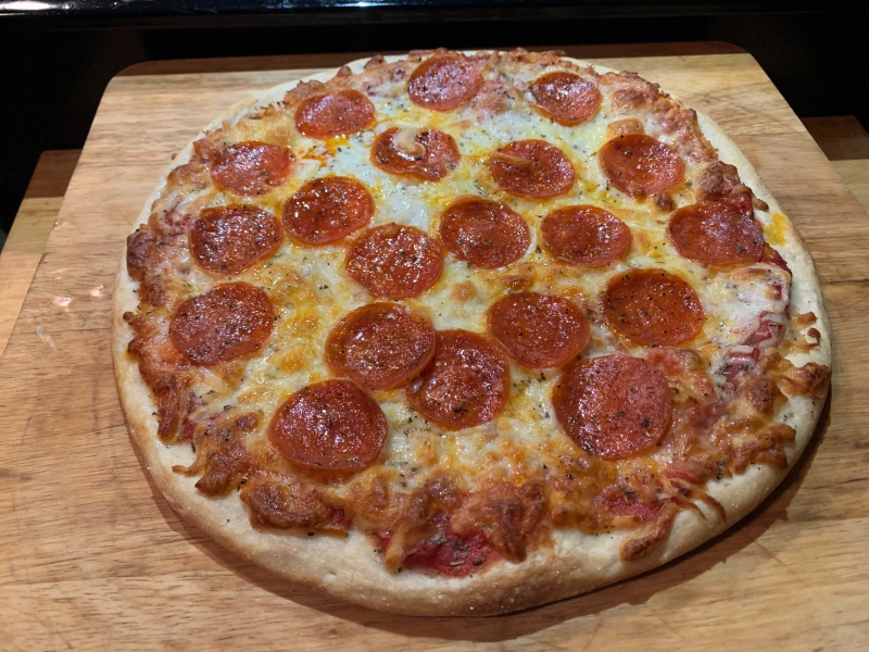 a pepperoni pizza, unsliced 