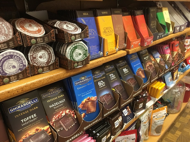 Chocolate on a shelf with brands such as Ghirardelli, Green and Blackâ€™s, and Taza on display. Photo provided by Walnut Street Tea Company.