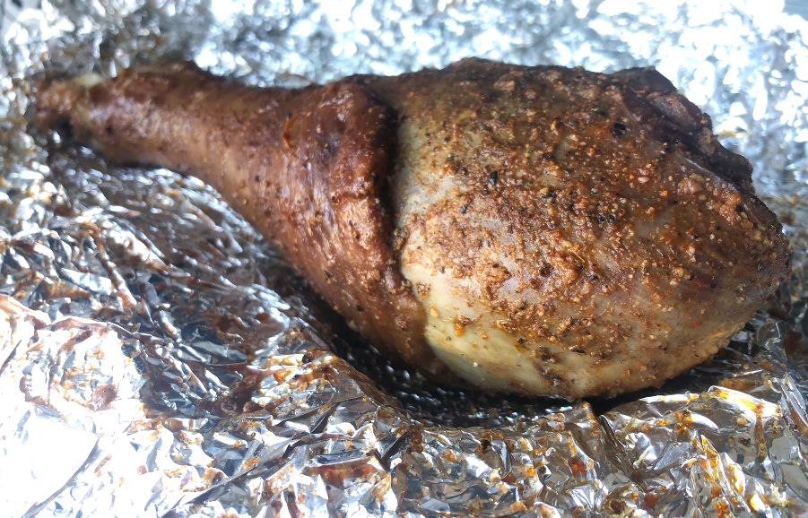 A turkey leg from Neil St. Blues is unwrapped from tin foil and dark brown, covered in seasoning. Photo by Alyssa Buckley.