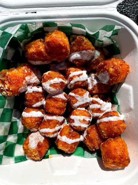 A side of sweet potato tots from Smith Burger Co. with a drizzle of marshmallow. Photo by Remington Rock.