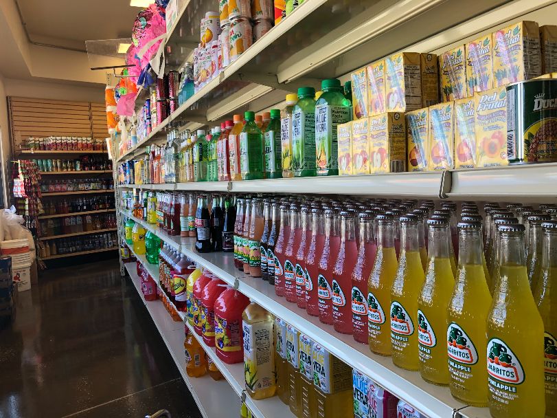 Shelves in El Progreso are full of brightly colored fruity drinks. Photo by Alyssa Buckley.