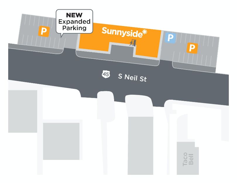 A simple grayscale drawing highlights a new expanded parking to the left of Sunnyside Champaign which is orange in the center of two gray parking lots. Photo by Alyssa Buckley.