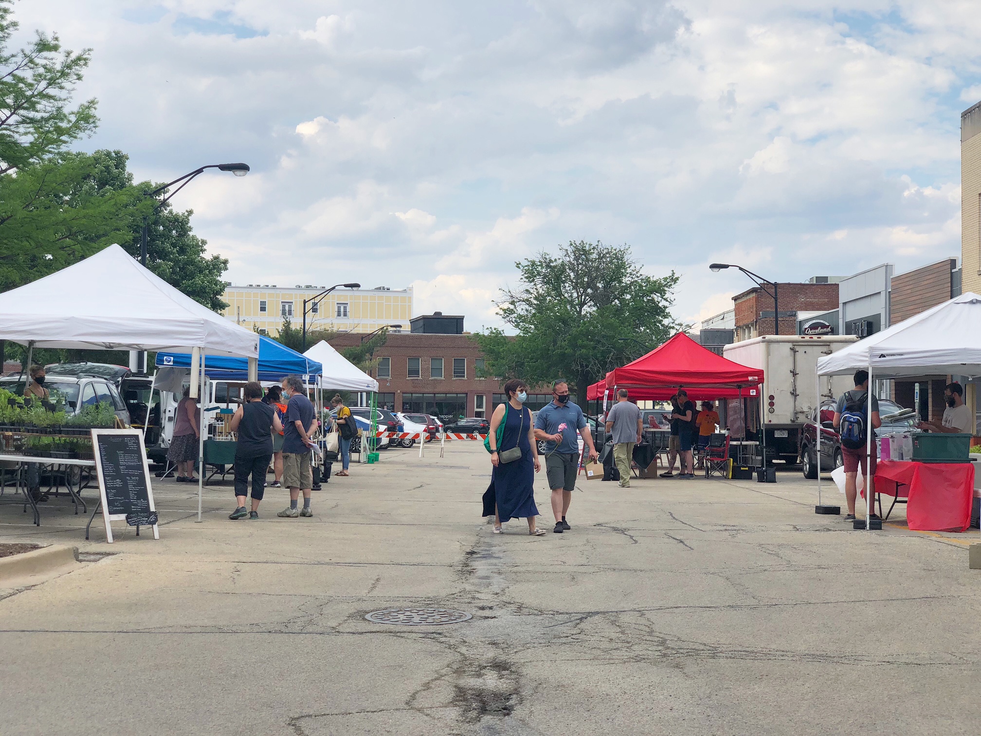 Shoppers are masked and walking around the Champaign Farmer's Market. Photo by Alyssa Buckley.