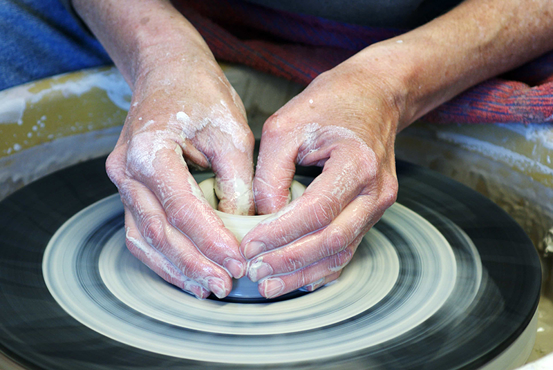 Photo of hands on a pottery wheel. Photo from the Boneyards Arts Festival website.