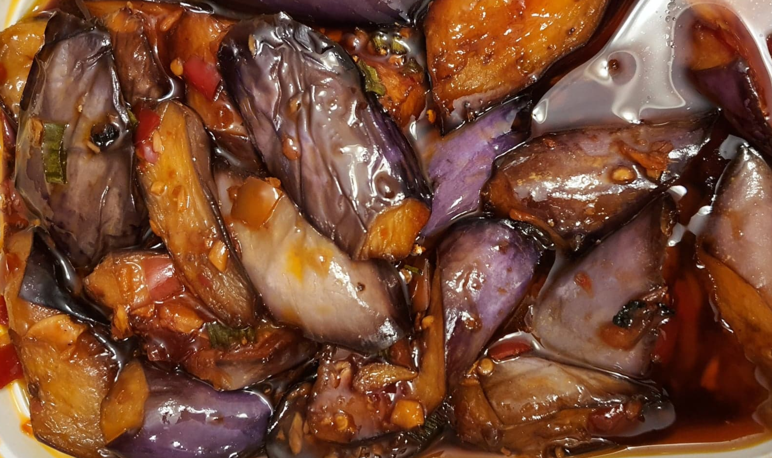 A very close up photo of the eggplant dish which is saucy and hard to tell that it's eggplant. Photo by Da Yeon Eom.