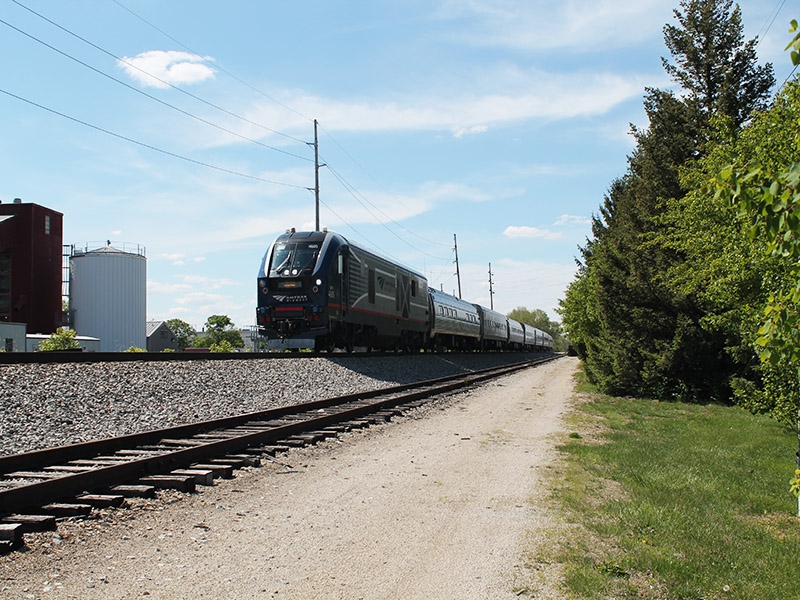 a freight train passes along a railroad 