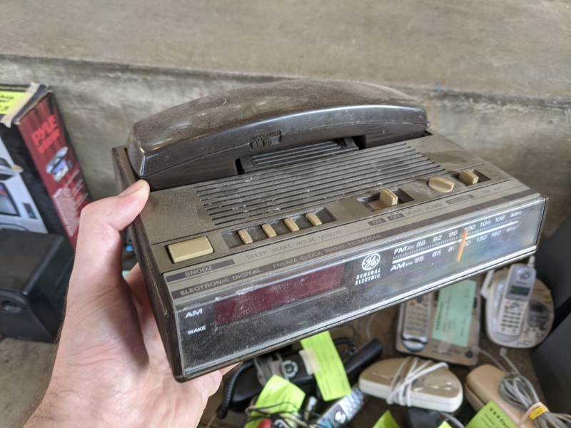 A dusty rectangular vintage clock radio. Photo by Tom Ackerman.