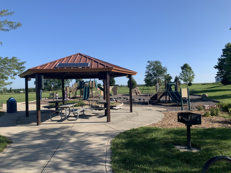 a gazebo and playground in a park 