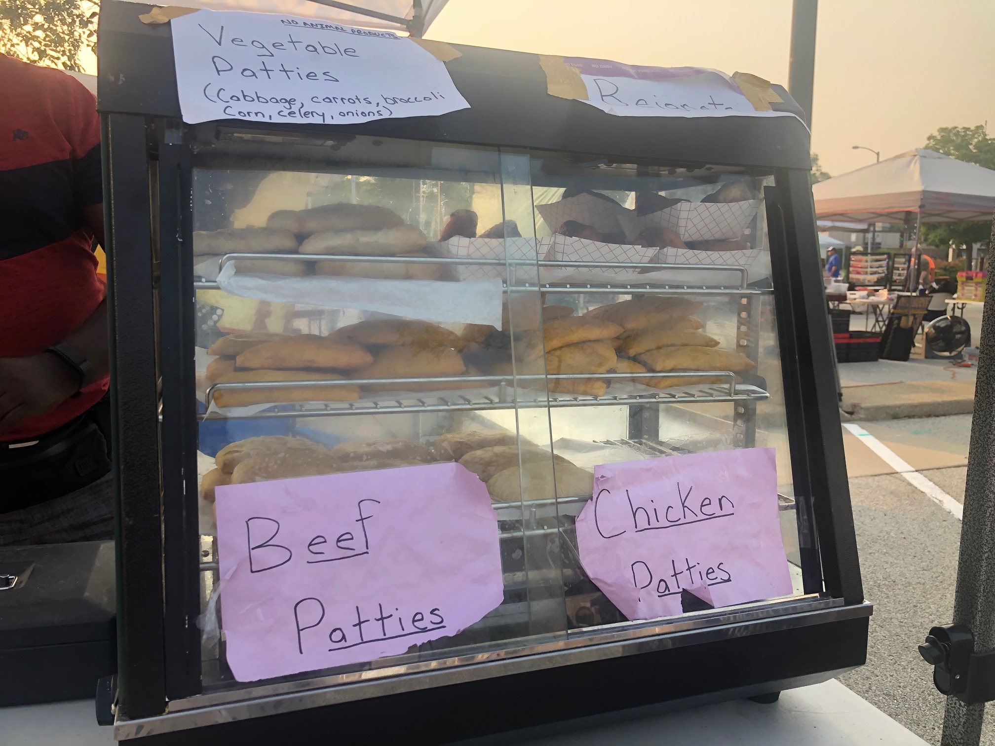 At the Urbana Market in the Square, there is a warming case of hand pies with handwritten names of the flavors of hand pie. Photo by Alyssa Buckley.