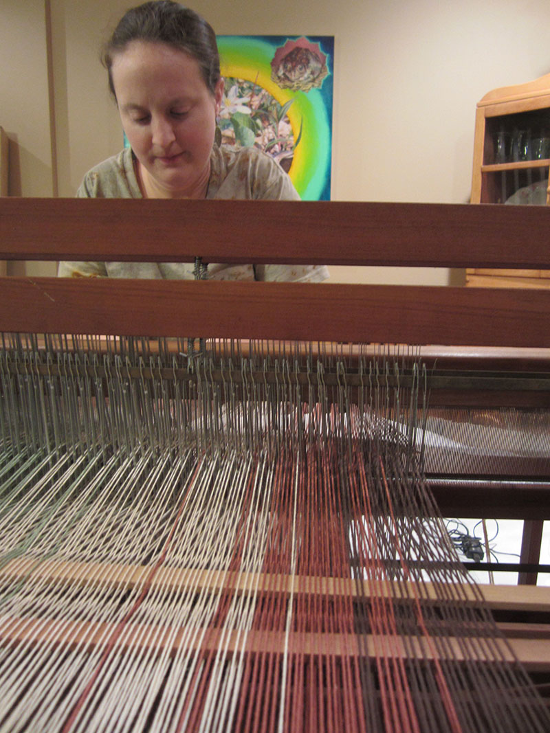 Artist Sarah Marjanovic at her loom. Photo courtesy of the artist.