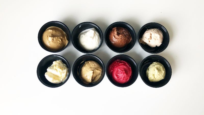 An overhead photo of eight mini cups of gelato of varying flavors. Photo by Alyssa Buckley.