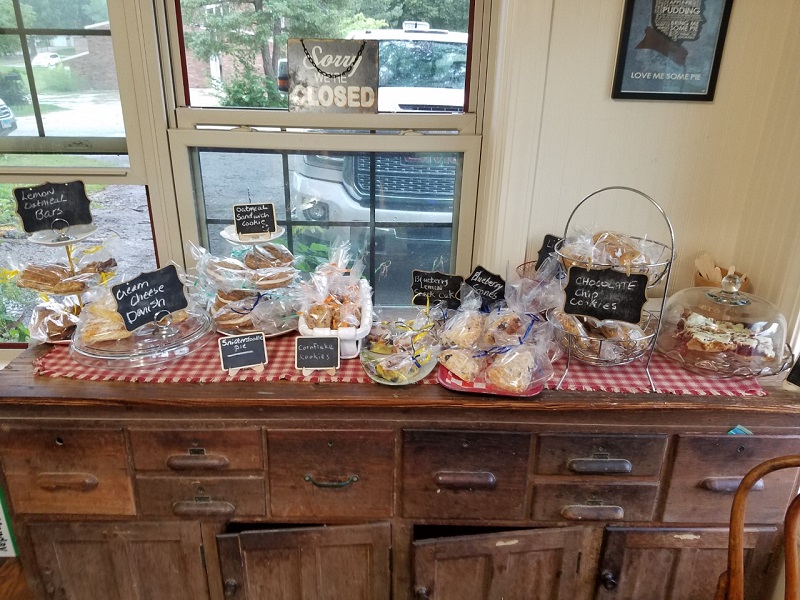 A display of packed goods on the counter inside of Lucky Moon that includes cookies, bars, and danishes. Photo by Matthew Macomber.