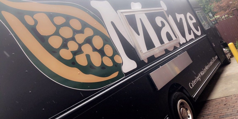 A side photo of the Maize truck has the logo diagonnaly as if taken from knee height. Photo by Maize.