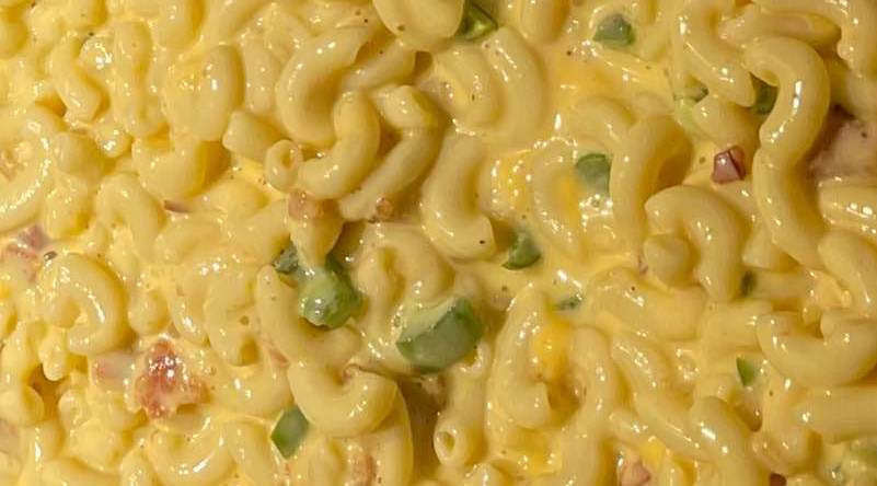 Elbow noodles in a cheesy yellow sauce with bits of jalapeno fill the image. Photo from The Ribcage's Facebook page.