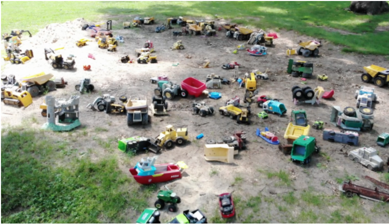 toy trucks in a sandbox 
